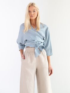 "CLAIRE is a linen wrap top. DETAILS - Wrap around blouse - 3/4 sleeves - Cropped length - 100% lightweight European linen fabric - Cut and sewn to order just for you in our studio COLOR - Bluestone, you can also choose other colors above - Fabric samples are available here https://www.etsy.com/listing/586569696/linen-fabric-samples SIZING & FIT - Relaxed fit - Length is approximately 20.5 inches / 52 cm - Bust is approximately 17.5 inches / 44.5 cm - Measurements taken from a size S - Model Casual Linen Wrap Top, Casual Linen Wrap Top For Summer, Fall Linen Blouse For Brunch, Chic Linen 3/4 Sleeve Blouse, Chic Linen Blouse With 3/4 Sleeves, Spring Linen Blouse In Flax Color, Linen Tops For Fall Brunch, Fall Linen Tops For Brunch, Spring V-neck Flax Top