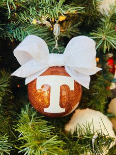 a christmas ornament with the letter j on it