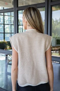 Elevate your style with the Aliya Mock Neck Sweater. Its sleek mock neck and trendy contrast trim detail add a touch of sophistication. Perfect for layering or wearing on its own, this sleeveless sweater is a versatile addition to your wardrobe. Stay cozy and chic in this oatmeal-colored sweater. General Info: 42% Acrylic, 30% Polyester, 28% Nylon Hand Wash Cold; Line Dry Mock Neck Contrast Trim Detail Sleeveless Fit Guide: Shape & Fit: Relaxed Fabric Elasticity: Stretchy Fabric Texture: Knit Model Info: Height: 5’8” | Bust: 30.5” | Waist: 23.5” | Hip: 33” | Size Shown: Small White Jumpsuit Dress, Plus Size Outerwear, Detailed Sweater, Sporty Girls, Fabric Texture, Sleeveless Sweater, Mock Neck Sweater, Trim Detail, Stay Cozy