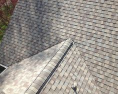 an aerial view of a roof that is missing shingles