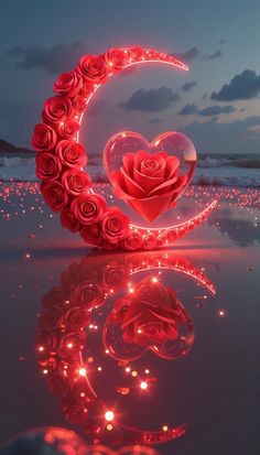 a heart shaped rose sitting on top of a table next to a moon and stars