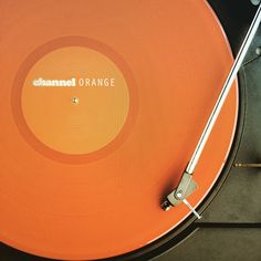 an orange record player with the word channel orange on it's side and its turntable