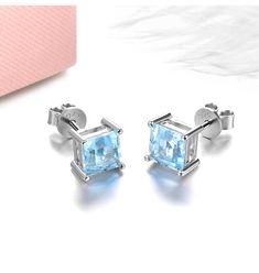 Elevate your look with these exquisite Stud Earrings, crafted in high-quality 925 Sterling Silver. They feature 6.0 x 6.0mm Square Cut Sky Blue Topaz stones that radiate captivating charm. The soft blue hue seamlessly complements the sterling silver setting, making them a versatile addition to any jewelry collection. Perfect for casual wear or special occasions. Specifications: Metal: 925 Sterling Silver Main Gemstone: Topaz Main Gemstone Cut: Square Cut Main Gemstone Size: 6.0 x 6.0mm Main Gems Classic Light Blue Sterling Silver Jewelry, White Gold Earrings With Blue Topaz Birthstone, Light Blue Topaz Gemstone Earrings, Light Blue Jewelry With Prong Setting For A Gift, Light Blue Blue Topaz Gemstone Earrings, Silver Topaz Birthstone Earrings, White Gold Blue Topaz Earrings For Gift, Elegant Light Blue Sterling Silver Earrings, Silver Blue Topaz Earrings Fine Jewelry