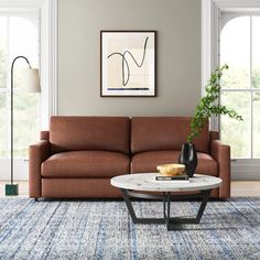 a living room scene with focus on the couch and coffee table