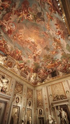 an ornate ceiling with paintings on it