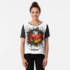 a women's t - shirt with an image of a soccer ball painted on it