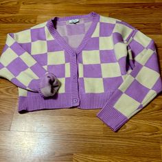 Petal Dew Cardigan For The Classic Girl In You Size Medium, Three Buttons Down The Front, Purple And Cream Checkered Hundred Percent Polyester Like New Without Tags Worn Once Trendy Purple V-neck Cardigan, Trendy Purple V-neck Sweater, Trendy Purple Long Sleeve Cardigan, Purple Long Sleeve Casual Cardigan, Casual Purple Long Sleeve Cardigan, Casual Long Sleeve Purple Cardigan, Trendy Purple V-neck Outerwear, Casual Purple V-neck Outerwear, Trendy Lavender Long Sleeve Cardigan