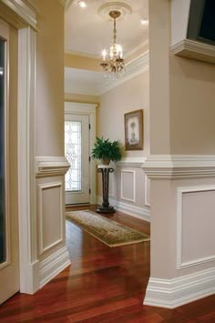 the hallway is clean and ready for us to use as an entrance way in this home