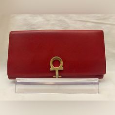 Salvatore Ferragamo Macaron Leather Long Wallet Continental Clutch Red With Gancio Closure. Beautiful Wallet In Euc. Approximate Measurements: 7.5''W X 4''H X 1''D Signature Gold-Tone Hardware, Frame Front Front Flap With Gancio Closure Fully Lined Interior Features 7 Credit Card Slots, 3 Slip Pockets, One Id Holder And One Zip Pocket Comes With Original Tags And Care Card Made In Italy. See Photos For Condition. Please Ask Any Questions Before Purchasing. Elegant Red Travel Wallet, Elegant Red Wallet For Business, Elegant Red Wallets For Business, Salvatore Ferragamo Bags, Leather Long Wallet, Care Card, Id Holder, Long Wallet, Salvatore Ferragamo