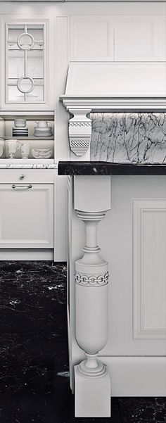 a kitchen with white cabinets and marble counter tops, along with an island in the middle