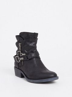 a pair of black boots with buckles on the side and zippers at the bottom