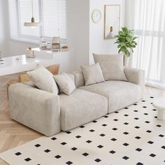 a living room filled with furniture and white walls