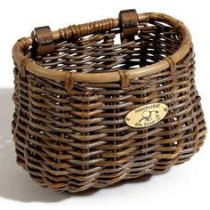 a brown wicker basket with a label on it