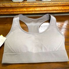 New Women’s Seamless Bra. Size Xl. Medium Support. Light Heather Gray. Removable Pads. By All In Motion. Gray Stretch Bra With Medium Bust Support, Solid Seamless Bra For Light Exercise, Seamless Stretch Bra For Light Exercise, Stretch Sleeveless Bra For Light Exercise, Stretch Bra For Light Exercise, Seamless Shaping Activewear For Sports, Sports Shaping Seamless Activewear, Zip Bra, Sports Bra Top