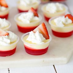 small dessert cups with strawberries and whipped cream