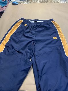 Starter U of M Track Pants expandable Zip Leg - opens additional 2” Lined Maize&Blue Men’s L42-44 1B Excellent condition See photos as I try to accurately represent the items condition and they are considered part of items description Ask questions prior to purchase please Ships fast Smoke free home U Of M, Maize And Blue, Track Pant, Maize, I Try, Track Pants, Blue Man, Bermuda Shorts, Track