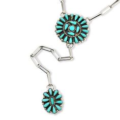 Chaco Canyon Sterling Silver Kingman Turquoise Cluster Lariat Necklace Add a fashionable touch of Southwestern style to your neckline with this delightful, dangling lariat-style necklace. Handcrafted by Native American artisans, the piece features trendy paperclip links connecting two stations of clustered, Kingman turquoise stones.       Necklace approx. 18"L x 1/16"W     Drop approx. 6-1/2"L x 1-7/16"W     Stamped .925; oxidized, polished finish     Lobster claw clasp     Paperclip link chain necklace has chain drop with flower-like cluster of oval turquoise stones dangling from base     Wheel-shaped center station adorned with pear- and round-shape turquoise stones   Stone Information       All sizes and weights approximate     Stabilized Blue Kingman Turquoise - Pear (4x6mm), round (5x Southwestern Style Turquoise Dangle Necklace, Turquoise Lariat Jewelry With Adjustable Chain, Adjustable Turquoise Lariat Necklace, Bohemian Turquoise Lariat Necklace With Adjustable Chain, Adjustable Lariat Turquoise Necklace, Southwestern Style Turquoise Lariat Necklace, Turquoise Lariat Necklace With Adjustable Chain, Bohemian Turquoise Dangle Lariat Necklace, Turquoise Bohemian Dangle Lariat Necklace