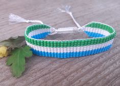 Loom beaded bracelet with Liberia flag. Patriotic hand woven beaded wristbandt is a great gift for a women, girl or child for birthday, Christmas, Valentine's Day and other holidays. Small frienship gift whis African country flag. Is suitable for daily wear. Bracelets in stock and ready to ship. More bracelets here: https://www.etsy.com/shop/BeadSeeShop?ref=seller-platform-mcnav&section_id=30144819 The bracelet is made of Czech seed beads and strong nylon thread. Width 15mm (0.6 inch) The length Handwoven White Beaded Bracelets For Gifts, White Handwoven Beaded Bracelets As Gift, White Handwoven Beaded Bracelets For Friendship, Adjustable White Handwoven Beaded Bracelets, Handwoven Bracelets As Summer Gifts, Handwoven Summer Bracelets As Gifts, Casual Handwoven Beaded Bracelets As Gift, Summer Woven White Beaded Bracelets, Summer White Woven Beaded Bracelets