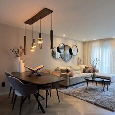 a living room filled with furniture and mirrors