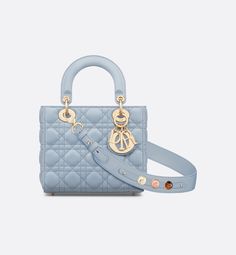 The Lady Dior My ABCDior bag epitomizes Dior's vision of elegance and beauty. Sleek and refined, the timeless style is crafted in pale blue lambskin with Cannage stitching, creating the unmistakable quilted texture. Pale gold-finish metal D.I.O.R. charms offer elegant appeal. Featuring a strap that can be personalized with symbolic badges, the small, unique design may be carried by hand or worn crossbody.. Lady Dior My Abcdior Bag, Dior Star, Dior And I, Icon Shoes, Dior Book Tote, Small Lady, Christian Dior Couture, Star Shoes, Backpack Tote Bag