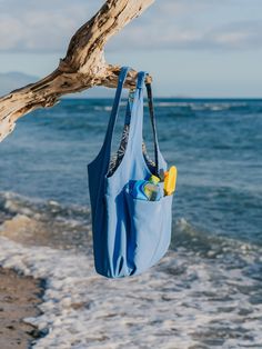 FINAL SALE! No returns or exchanges allowed. Bring our water-resistant, multi-tasking, nylon cargo tote on your everyday adventures. It’s durable, spill-proof, and roomy enough for a full day of work and play. Beach bag, travel tote, grocery hauler, diaper bag, gym, weekender; You name it, and our Cargo Tote can handle it. Main body 16" base long length, 12" depth/width, sidewall height 12" shoulder strap drop length 11.75". Fabric Content: 100% nylon exterior and 100% poly lining Blue Packable Travel Bag, Waterproof Blue Nylon Bags, Blue Nylon Bag With Functional Pockets, Sporty Blue Bag With Water Bottle Pocket, Blue Multifunctional Bag For Everyday Use, Blue Multifunctional Everyday Bag, Multifunctional Blue Bag For Everyday, Multifunctional Blue Everyday Bag, Blue Nylon Bag With Water Bottle Pocket