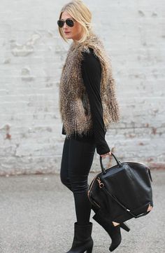 a brown fur vest looks so effortlessly chic with an all-black ensemble Chic Outerwear With Faux Fur Lining For Work, Versatile Outerwear For Winter Day Out, Chic Fall Outerwear With Faux Fur Trim, Versatile Winter Outerwear For Day Out, Chic Faux Fur Outerwear For Work, Trendy Winter Outerwear For Going Out, Fitted Winter Outerwear For Going Out, Elegant Winter Outerwear For Going Out