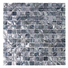 the back side of a glass mosaic tile with grey and white squares on it,