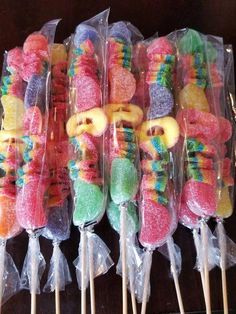 there are many colorful candy sticks in plastic bags