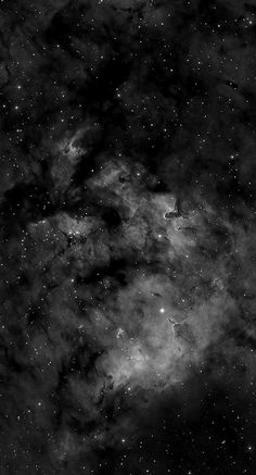 black and white photo of the sky with stars