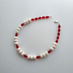 < One strand white coral and glass beaded necklace> The coral is natural, from the bottom of the Pacific Ocean. The clasp is made from metal. > Necklace length - 38 cm (14,9 in) > Necklace weight - 41 grams White Jewelry With Oval Wooden Beads, White Shell Necklace With Gemstone Beads For Beach, Red Gemstone Beads Necklace For Beach, Red Gemstone Beads Necklaces For The Beach, Red Gemstone Beaded Necklace For Beach, Red Coral Necklaces For Beach, White Shell Necklace With Large Round Beads, Red Polished Bead Necklaces For Beach, White Wooden Beaded Necklaces For Beach