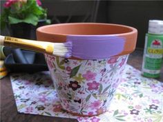 a flower pot with a paintbrush in it