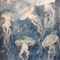 watercolor painting of jellyfish in blue and white