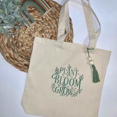 This beautiful plant bloom grow shopping tote bag made with 100% organic cotton, has intentionally handles reinforced. You can use this bag also for a visit to the library, day at the beach or a day of grocery shopping. Surprise a friends, maid of honor, bridesmaid, mother or any family loved one with this aesthetic organic tote bag! Tote Canva Bag Durable 6-ounce, 100% certified organic cotton tote bags Chemical Free Organic cotton handles reinforced with stress-point stitching Expandable botto Library Day, Grow Shop, Iron Design, Shopping Tote Bag, Chemical Free, Grocery Shopping, The Library, Shopping Tote, Family Love