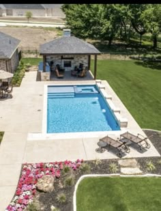 an aerial view of a pool and patio area