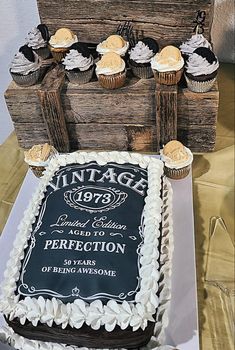 an old wooden box with cupcakes on it and a sign that says vintage