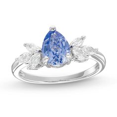 a blue and white diamond ring with leaves