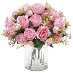 a vase filled with lots of pink flowers