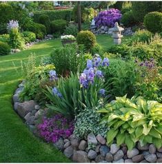 a garden filled with lots of different types of flowers