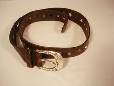 "Here is a Vintage 1980s Brown Leather Belt from the Express.  It has Rhinestones and Star Cutouts.  It will fit size s and M.  It is 36\" long not including the buckle and it is 1 1/4\" wide. Any questions, just ask me." Brown Leather Belt, Brown Belt, Suspender Belt, Suspenders, Belt Buckles, Leather Belt, Etsy Vintage, Brown Leather, Top Handle Bag