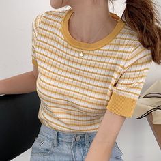 Short sleeve ribbed knit shirt with multicolored stripes. S/M: 28"-44" chest, 26"-40" waist, 17" length Retro Striped Ribbed Tops, Casual Spring Sweater With Striped Hem, Retro Ribbed Striped Tops, Striped Ribbed Short Sleeve Tops, Trendy Striped Hem Tops For Fall, Trendy Fall Tops With Striped Hem, Fitted Striped Ribbed T-shirt, Knit Crew Neck Tops With Striped Sleeves, Spring Striped Stretch Sweater