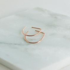 These little tinies are so easy to wear and perfect for the office! The flat part sits flush against the back of your earlobe, making a lovely, small hoop earring that's perfect for that minimal look! Approx. 15mm x 15mm Material choices: 14k rose gold filled, 14k yellow gold filled, or sterling silver // Minimalist Nickel-free Hoop Earrings, Minimalist 14k Gold Huggie Earrings, Minimalist Tarnish-resistant Huggie Earrings, Minimalist Small Hoop Huggie Earrings, Minimalist 14k Rose Gold Huggie Earrings, Minimalist Nickel-free Everyday Cartilage Earrings, Minimalist Nickel Free Cartilage Earrings For Everyday, Minimalist Nickel-free Cartilage Earrings For Everyday, Minimalist Rose Gold Huggie Cartilage Earrings