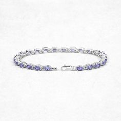 6.25 Carat Genuine Tanzanite .925 Sterling Silver Bracelet Product Details: Metal: .925 Sterling Silver Setting: prongs Item: Bracelet Finish: Rhodium Plated Metal Stamp: 925 QJ™ IN Total CTW: 6.25 Carat Length 7.50 inches Width 4.06 MM Height 4.06 MM Weight: 9.05 Grams Chain Type: No Chain Type Clasp Type: Single Strand Fishhook Gemstone Information: Tanzanite Quantity: 25/6.25 ctw Shape / Size: Oval/5x3mm Classic Oval Gemstone Tennis Bracelet, Oval Diamond Bracelet With Polished Finish As Gift, Classic Sterling Silver Gemstone Bracelet, Classic Round Sterling Silver Bracelet With Gemstone, Classic Sterling Silver Bracelet With Gemstone, Oval Sterling Silver Bracelet, Oval Sterling Silver Bracelet Fine Jewelry, Adjustable Oval Fine Jewelry Bracelet, Classic Sterling Silver Oval Gemstone Bracelet