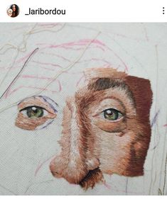 an embroidered portrait of a woman's face