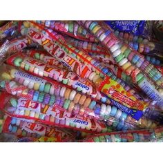 a pile of candy wrapped in plastic wrappers