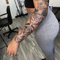 a woman with a tattoo on her arm and leg