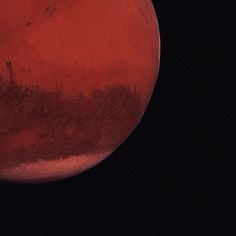 the red planet is seen from space in this image, it appears to be very dark