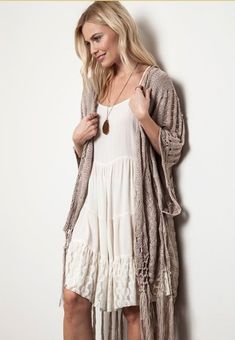 Boho Beautiful...turn any outfit into a boho masterpiece with this taupe crochet knit open poncho. Hangs beautifully with a bit of sheen to the knit. Simply stylish and stunning! 55% cotton 45% polyester S/M M/L