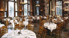 a dining room filled with lots of tables and chairs