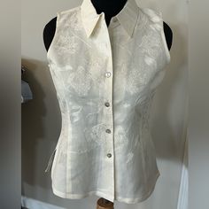 Gorgeous Sleeveless Embroidered Blouse. Creamy Off-White. Full Button Front With Beautiful Mother Of Pearl Buttons. Linen-Like Ramie/Cotton Blend. Brand New. 26 Inches Long. 20 Inches Pit To Pit. Elegant Embroidered Sleeveless Vest, Elegant Button-up Summer Vest, Elegant Summer Button-up Vest, Elegant Button-up Summer Tank Top, Elegant Button-up Tank Top For Summer, Classic Sleeveless Blouse With Buttons, White Sleeveless Blouse With Buttons, Sleeveless White Blouse With Buttons, Classic Sleeveless Buttoned Blouse