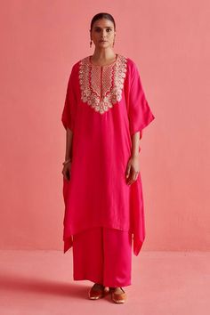 Fuchsia pink batwing sleeves hand embroidered crepe silk kaftan adorned with dainty brass coins, mukaish threadwork and intricate mughal floral motifs at neckline. Paired with a palazzo. - Aza Fashions Mughal Floral Motifs, Silk Kaftan, Silk Embroidery, Thread Work, Fuchsia Pink, Floral Motifs, Batwing Sleeve, Aza Fashion, Floral Motif